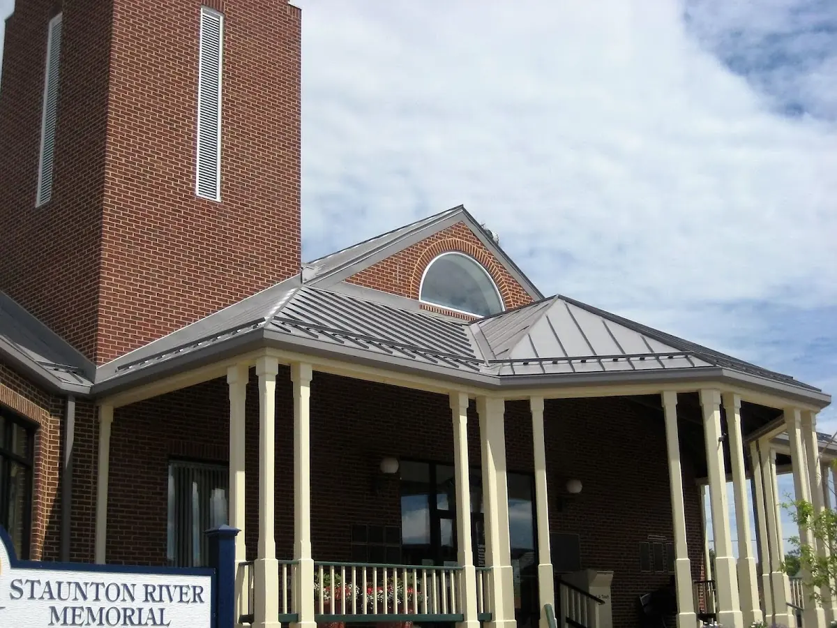 Skilled roofing craftsmen working on a residential roof in Towle